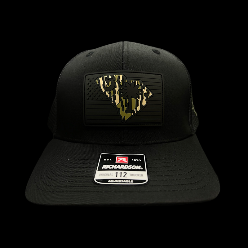 864 Richardson Bottomland Camo Performance PVC Patch Blackout Trucker Hat