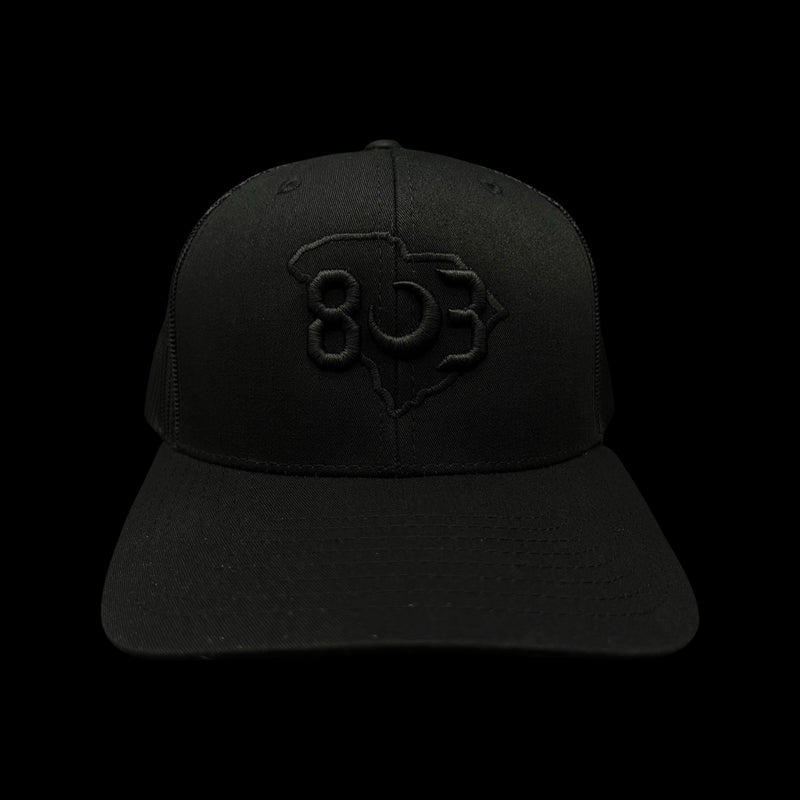 803 Yupoong Black Trucker - silver logo